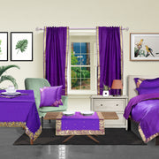Purple sari rod pocket curtains hung at a window