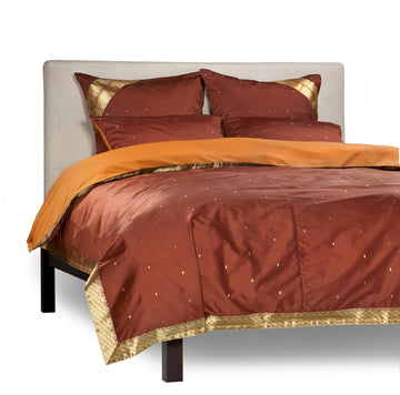 Brown sari duvet cover set made up on a bed