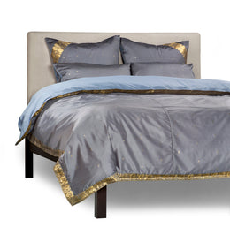 Gray sari duvet cover set made up on a bed