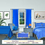 Blue sari tab top curtains hung at a window