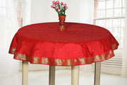 Fire brick sari tablecloth laid on a dining table