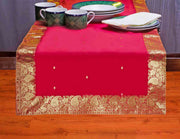 Fire brick silk table runner running down a dining table