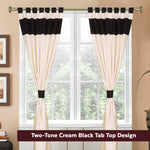 Cream raw silk tab top curtains hung at a window
