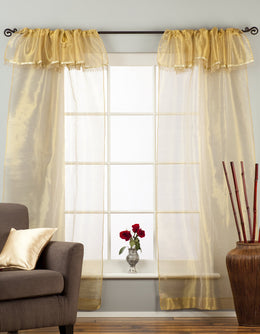 Golden rod sheer tissue rod pocket curtains hung at a window