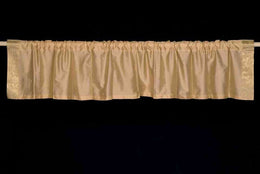 Golden rod sari valance mounted above a window