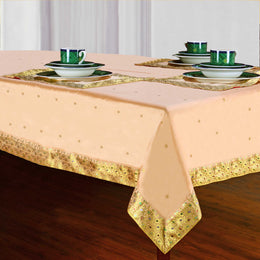 Golden sari tablecloth laid on a dining table