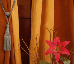 Gray sari curtain tiebacks holding a panel open