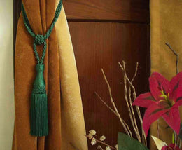 Green sari curtain tiebacks holding a panel open