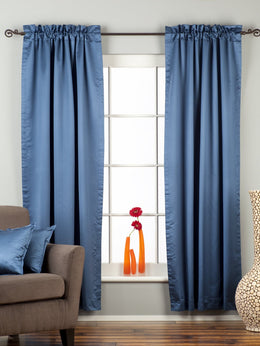 Blue sari rod pocket curtains hung at a window