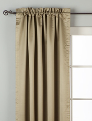 Olive green sari rod pocket curtains hung at a window