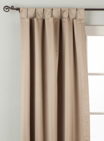 Gray sari tab top curtains hung at a window