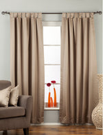 Gray sari tab top curtains hung at a window
