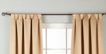 Taupe sari tab top curtains hung at a window