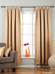 Taupe sari tab top curtains hung at a window