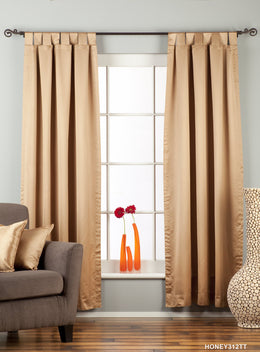 Taupe sari tab top curtains hung at a window