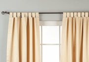 Golden sari tab top curtains hung at a window