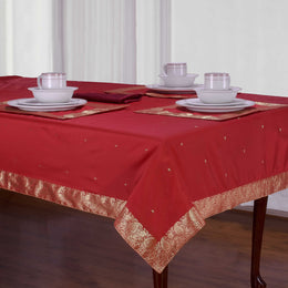 Fire brick sari tablecloth laid on a dining table