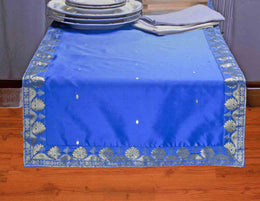 Blue silk table runner running down a dining table