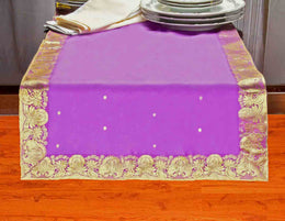 Calming lavender silk table runner running down a dining table
