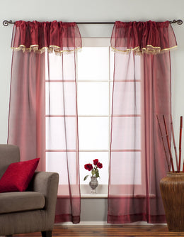 Maroon sheer tissue rod pocket curtains hung at a window