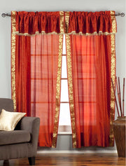 Cream sari rod pocket curtains hung at a window