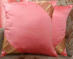 Peach sari cushion covers arranged on a sofa
