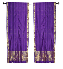 Purple sari rod pocket curtains hung at a window