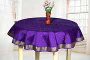 Regal purple sari tablecloth laid on a dining table