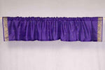 Purple sari valance mounted above a window