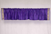 Purple sari valance mounted above a window