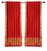 Red sari rod pocket curtains hung at a window