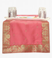 Peach silk table runner running down a dining table