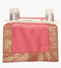 Peach silk table runner running down a dining table