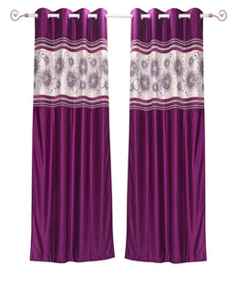 Wine sari grommet top curtains hung at a window