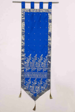 Blue sari wall hanging displayed on a wall