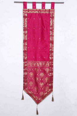 Pink sari wall hanging displayed on a wall