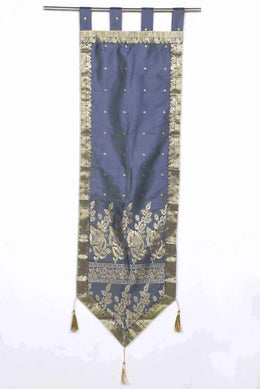 Gray sari wall hanging displayed on a wall